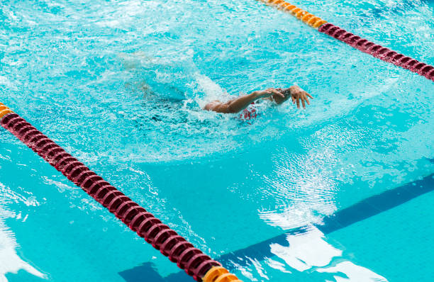 istock Young athletic man swimming in olympic pool. 1315224426