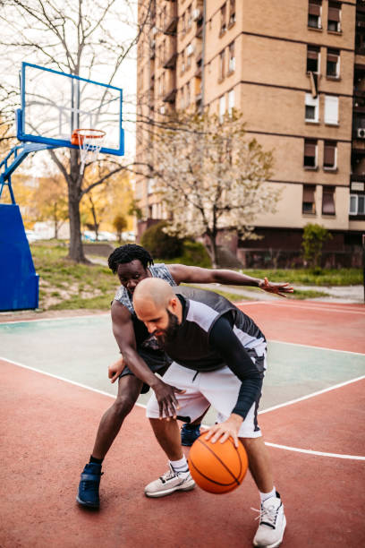 istock Man playing defense at his rival in basketball game 1315224497