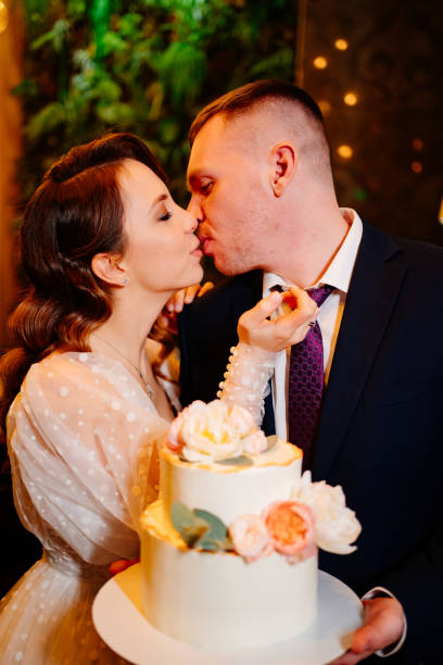 istock Bride and groom with wedding cake. wedding traditions 1315224580