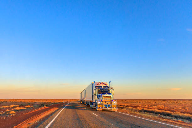 Gilberts road-train truck of Kenworth Northern Territory, Australia - August 29, 2019: Gilberts road-train truck of Kenworth crossing the highways of the Northern Territory of Australian Outback at sunset. outback stock pictures, royalty-free photos & images