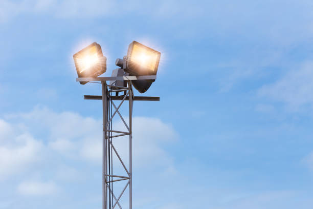 istock LED outdoors flood light, spot light on at high post for large area park ground security 1315224971