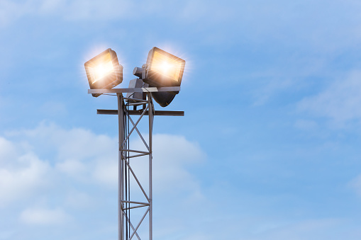 LED outdoors flood light, spot light on at high post for large area park ground security
