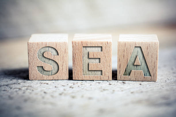 SEA Search Engine Advertising Written On Wooden Blocks On A Board - Business Marketing Concept SEA Search Engine Advertising Written On Blocks On A Wooden Board - Business Marketing Concept sem stock pictures, royalty-free photos & images