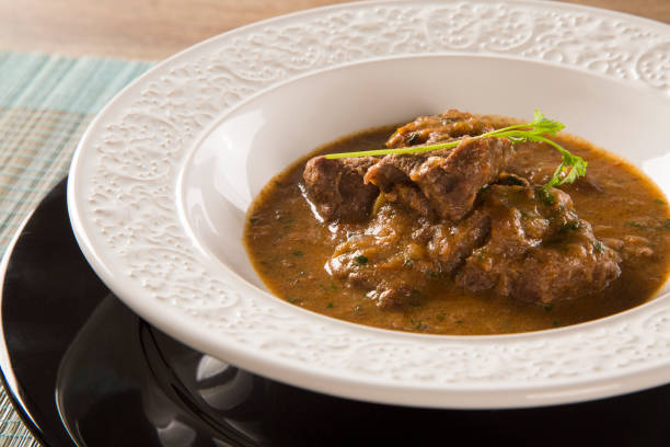 istock Rustic Stew meat with sauce in the white plate 1315227936
