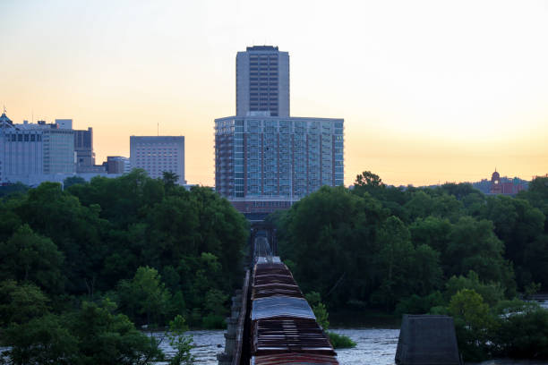 istock Train crossing the River at Sunrise 1315229211