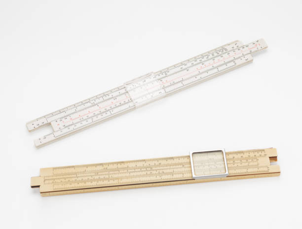 istock Two old slide rulers on white background 1315237319
