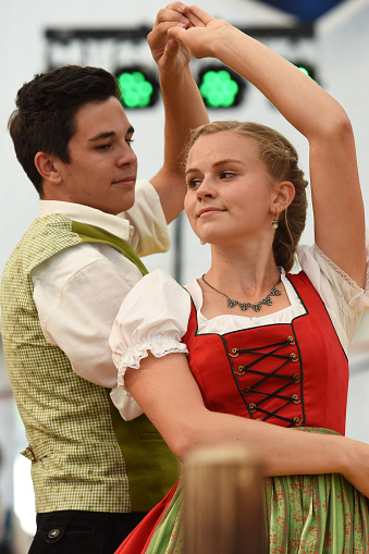 Public performance of traditional Austrian folk dances at the Festival of Folk Culture in Oberwang, Austria