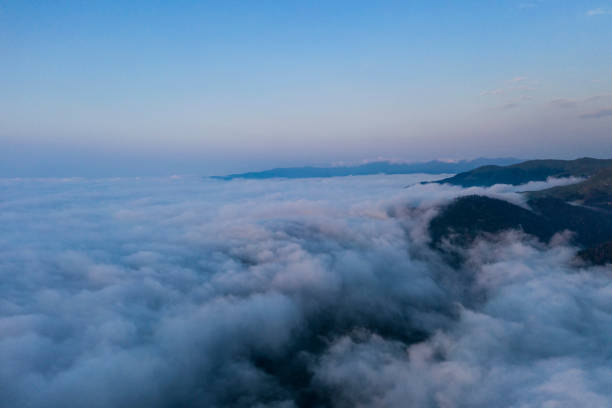 istock Mountains above the clouds beautiful sunset 1315238848
