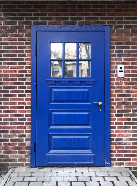 istock Beautiful blue door in a brick wall 1315239888