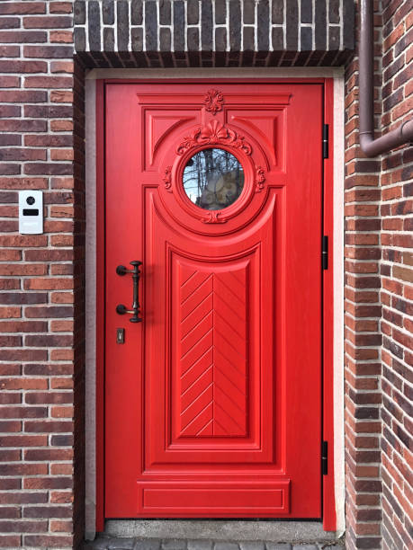 istock Beautiful red door in a brick wall 1315239890