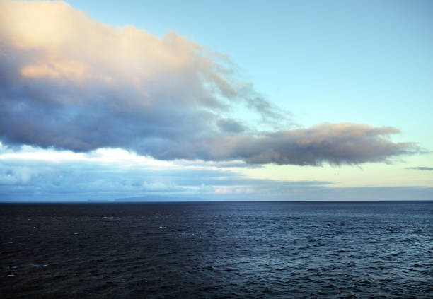 istock Stormy clouds over dark ocean 1315239912