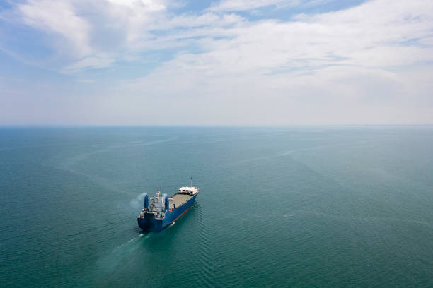 Aerial view of Cargo Ship Vessel in transit. Freight ship approaching to port. import export logistic and export products worldwide