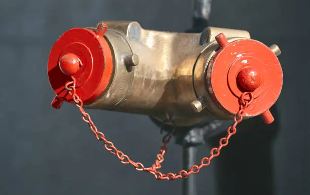 Close up picture of a standpipe on a street of New York, selective focus, USA.