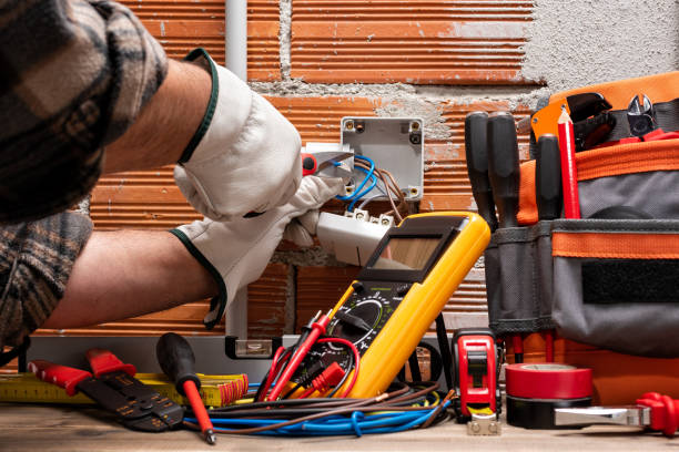Electrician at work on a residential electrical system. Electricity. Electrician worker at work with scissors prepares the electrical cables of an electrical system. Working safely with protective gloves. Construction industry. wire cutter stock pictures, royalty-free photos & images