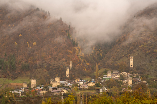 View over the Caucasus Mountains, and Mestia in Georgia. 
A rainy autumn day.