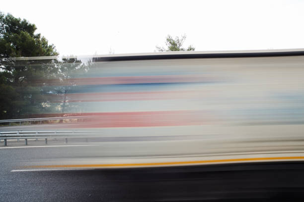 istock Fuzzy Movement of loaded trucks on the road 1315246065