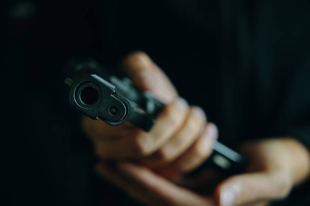 istock Close up of man reloading pistol. 1315246459