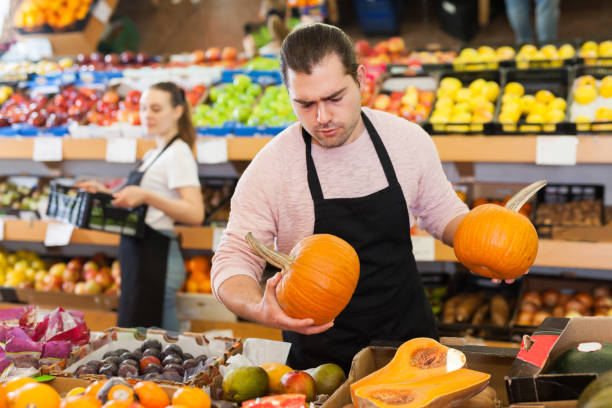 istock Adult man with pumpkin in hands 1315246552