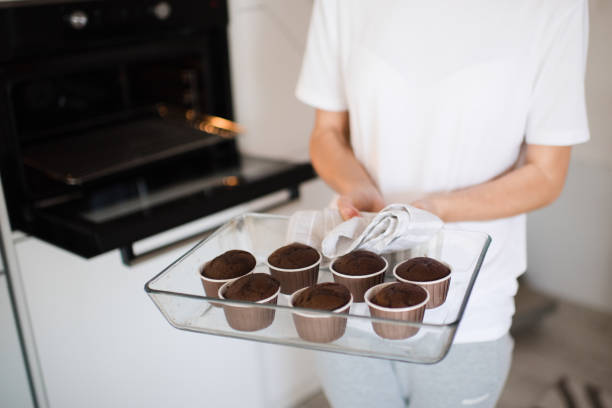 istock Woman making chocolate cupcakes indoors 1315247977