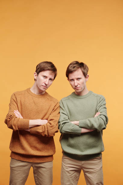 istock Portrait of scowling tweens 1315247987