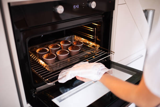 istock Woman making chocolate cupcakes indoors 1315248744