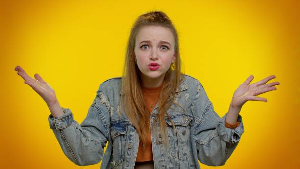 istock Girl raising hands in indignant expression asking why what reason of failure demonstrating disbelief 1315249855
