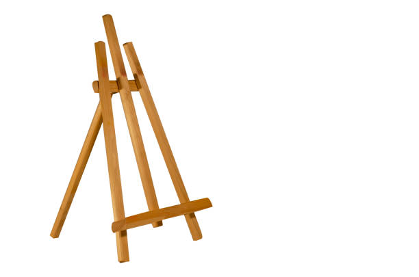 istock Table wooden easel and black blank canvas. Isolated objects on white background.Template for inscription, drawing. 1315251589