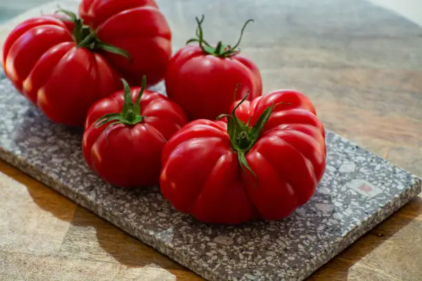 Ripe pink tasty monterosa tomatoes from Spain close up