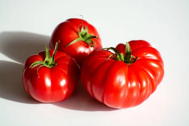 Ripe pink tasty monterosa tomatoes from Spain close up