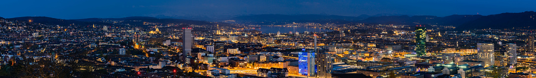 Great blue hour cityscape panorama of Zürich, the largest city in Switzerland. It is located in north-central Switzerland at the northwestern tip of Lake Zürich.