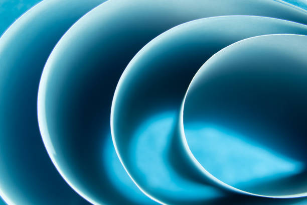 istock Abstract blue colored background with curved lines and shapes 1315252990