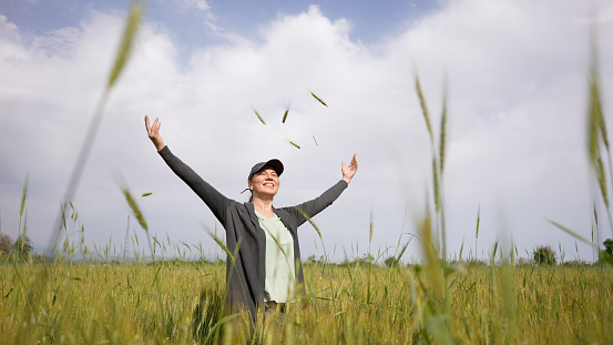 Woman Feeling free outdoor in the wheat field