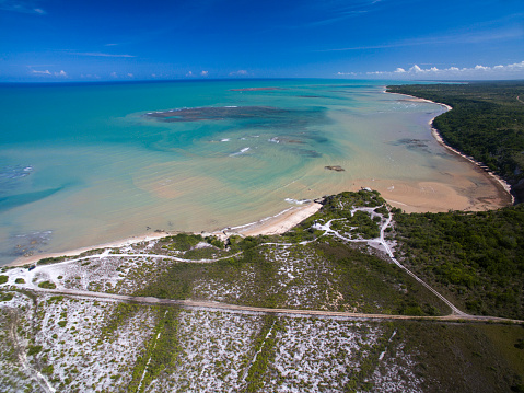 Aerial view Green sea at a brazilian beach coast on a sunny day in Moreira's Beach, Bahia, Brazil. february, 2017.