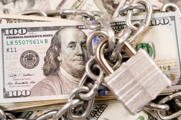 istock American paper currency under lock and chain. 1315255174