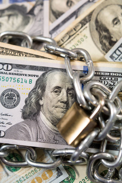 istock American paper currency under lock and chain. 1315255182