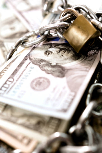 istock American paper currency under lock and chain. 1315255714
