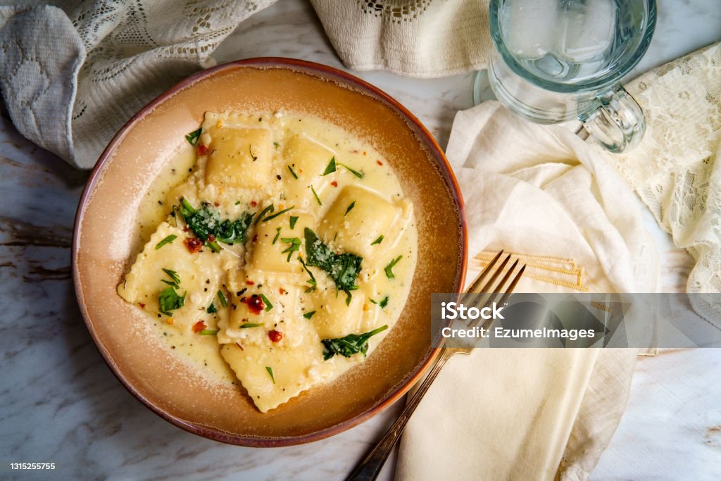 Tuscan Creamy Cheese Ravioli Cheese ravioli in a Tuscan creamy sauce with spinach and crushed red pepper Ravioli Stock Photo