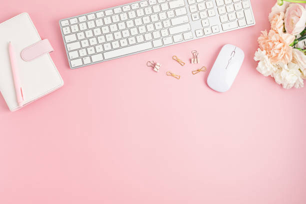 istock Home office desktop and flowers. Modern workspace with notebook, office stationary 1315256086