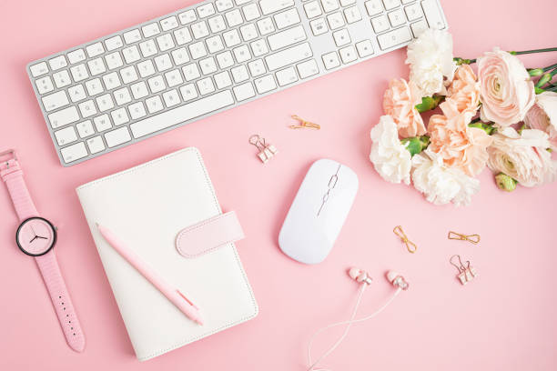 istock Home office desktop and flowers. Modern workspace with notebook, office stationary 1315256144