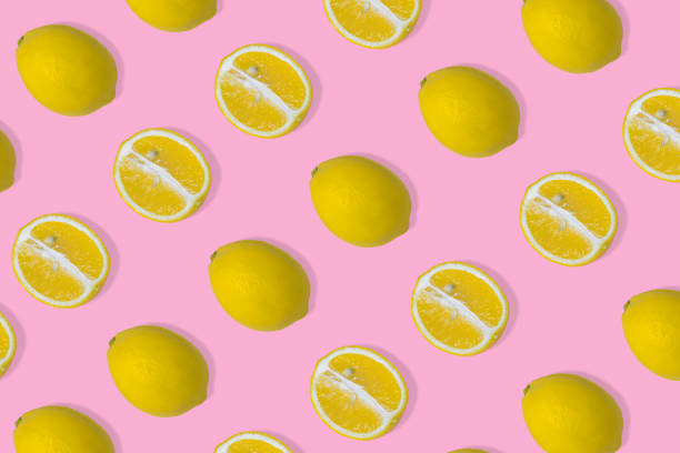 istock Trendy summer pattern with yellow lemon slice on bright pink background. 1315258210