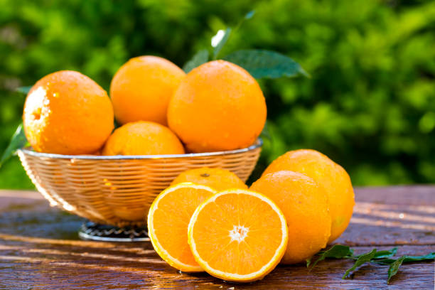 istock Sweet fresh oranges in natural light on old wood 1315260697