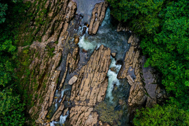 istock Top view of a river going through a rock bed that is worn out from the water 1315266385