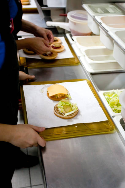 istock Making burgers from cutlets and shelves at McDonald's 1315267718