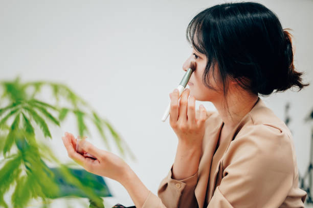 istock Young woman applying makeup with a smile 1315271237
