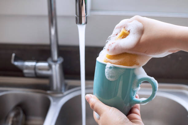 istock Woman is washing coffee cup. 1315274554