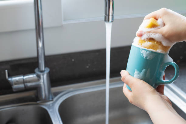 istock Woman is washing coffee cup. 1315274572