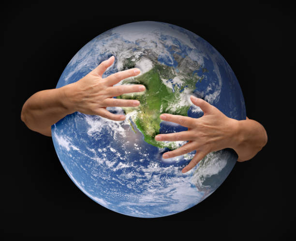 istock Human Arms Embracing and Nurturing the Planet Earth 1315276282