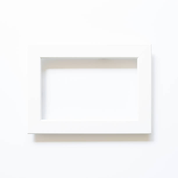 istock White picture frame on white background. top view, copy space 1315284913