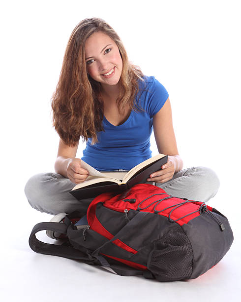 istock Teenage student girl reading school study book 131528957