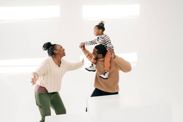 istock Laughing toddlers with parents 1315289606